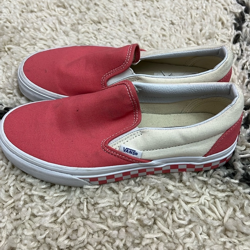 Gently used Vans classic slip-ons in pink and white with a checkered sole